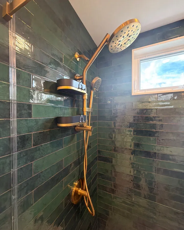 After: the brass shower column under the new window