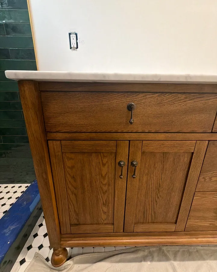 During: the double vanity set on the new tile floor