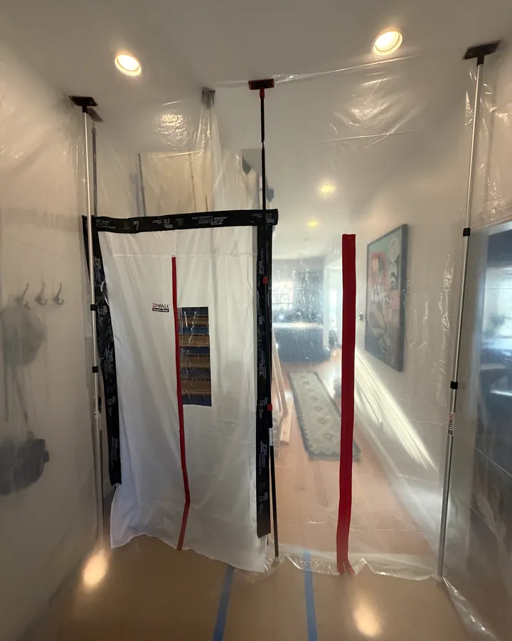 During: zip doors and plastic seal the work off from the rest of the house