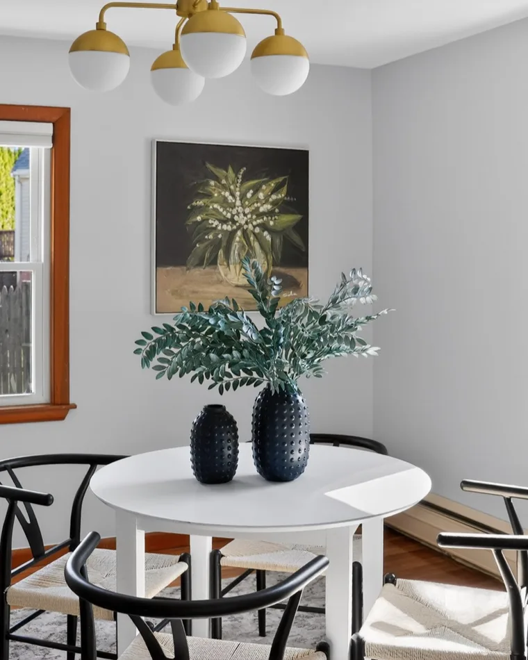Dining room under a brass chandelier, Roslindale